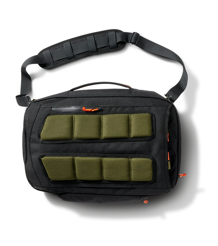 The Roark 3 Day Fixer Bag easily attaches to a luggage handle for seamless travel.