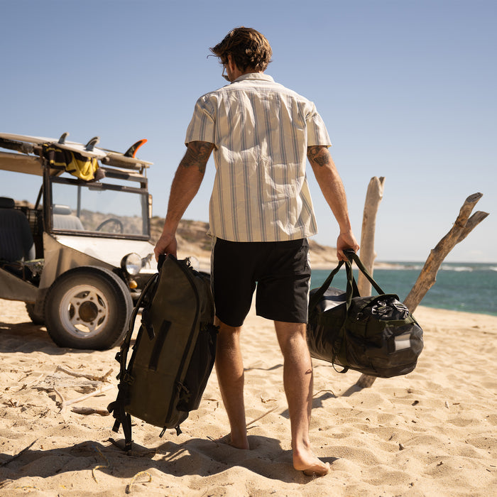 life-style-image Roark adventure-ready backpack displayed in a rugged outdoor setting, ideal for travel and exploration