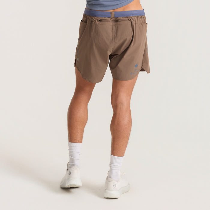 A close-up of various styles of Roark active and board shorts, including calf-length, Bermuda, and trunks, perfect for outdoor and travel adventures.