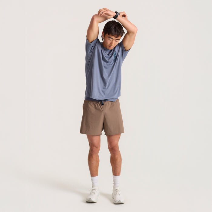 Close-up of active bermuda boardshorts designed for adventure, highlighting durability and comfort in an outdoor setting.