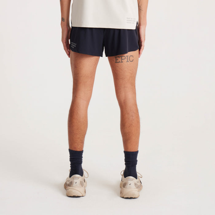Back view of black running shorts featuring secure waistband and stylish branding, designed for optimal running performance.