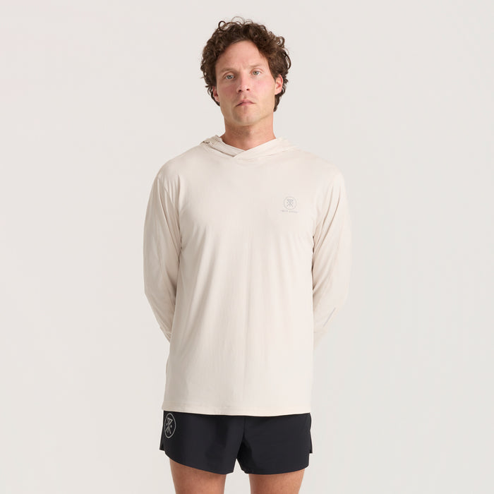Long-sleeved active shirt in gray, designed for adventure, featuring a comfortable fit for travel and outdoor activities.