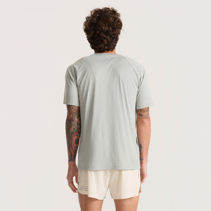Grey active shirt designed for adventure and outdoor activities by Roark, featuring breathable fabric perfect for running and travel.