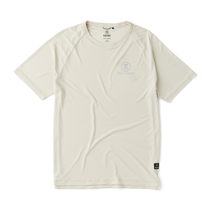 Close-up of a Roark active shirt featuring distinctive sleeve design with visible logo, emphasizing high-quality textile ideal for adventure and travel.