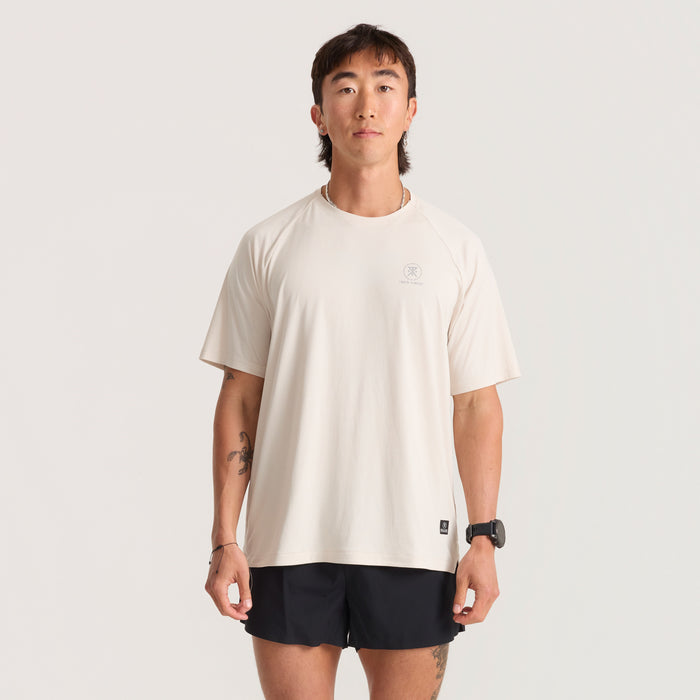 Active grey shirt featuring sturdy sleeves and a comfortable neck, perfect for outdoor adventures and travel.
