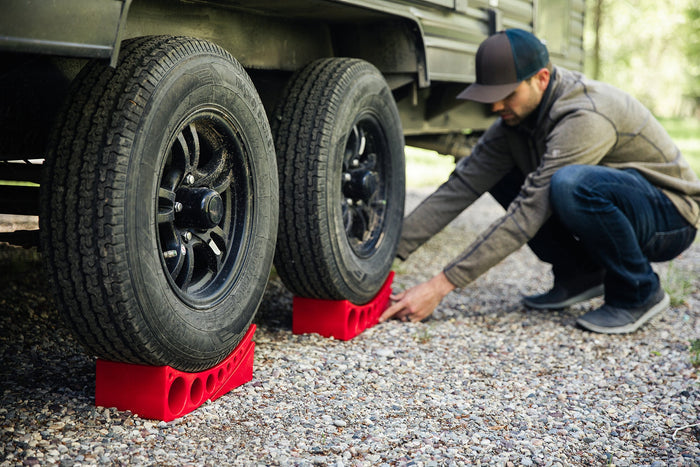 RV Owner Installing Red Andersen Leveling Blocks - Setup View | United RV Parts