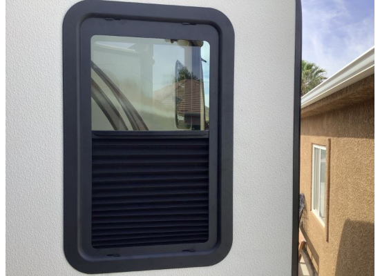 RV Door Window Shade - Partially Lowered Position Exterior View | United RV Parts