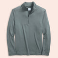 Steel gray long-sleeve quarter zip on a light pink background