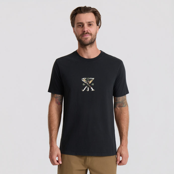 Black short sleeve t-shirt with small geometric logo on chest, worn by man with tattoos against neutral background
