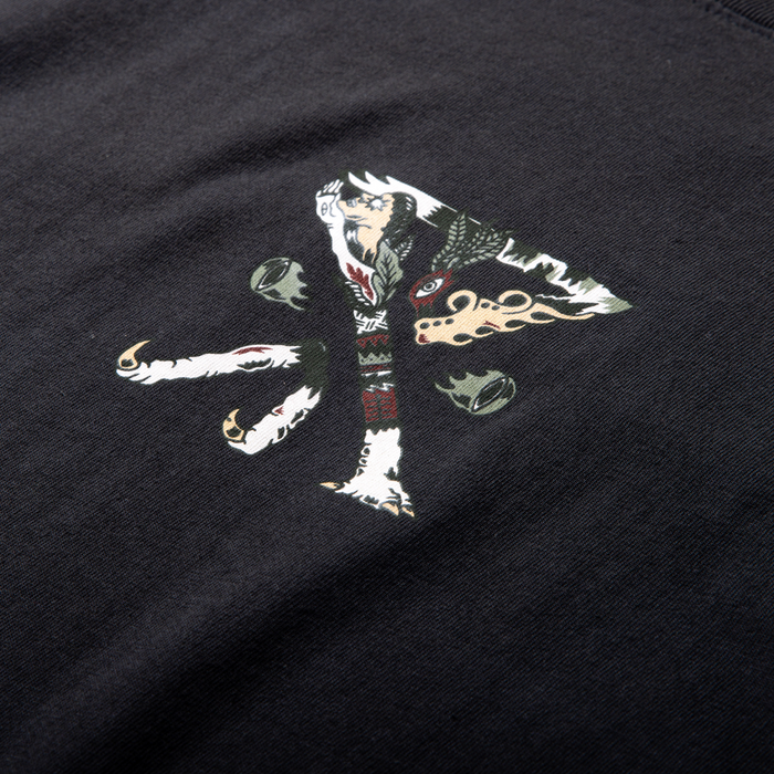 Washed black short sleeve tee featuring colorful graphic illustration of stylized character with white hair and decorative embellishments