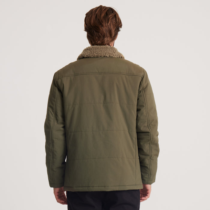 Front view of a men’s olive green insulated jacket featuring a sherpa-lined collar, toggle closures, and practical patch pockets, blending style and functionality for winter.