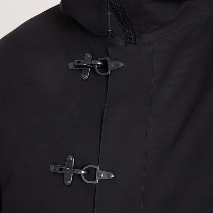 Black Axeman Parka jacket with toggle and horn button closures, detail shot showing front fasteners