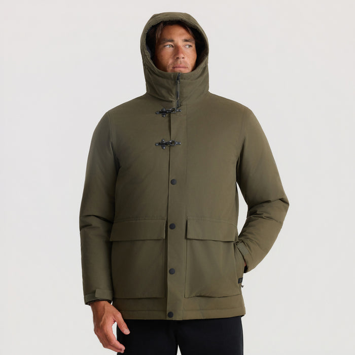 Olive green Axeman Parka Jacket worn by man with hood up, featuring toggle and button closures, on neutral background