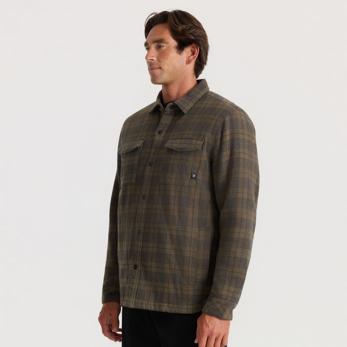 Backwoods Jacket in military green plaid worn by man in profile view against neutral background