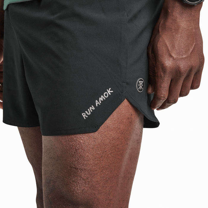 Front view of a man wearing Roark Campover Cargo Pants in Khaki, highlighting their relaxed fit and multiple pockets.