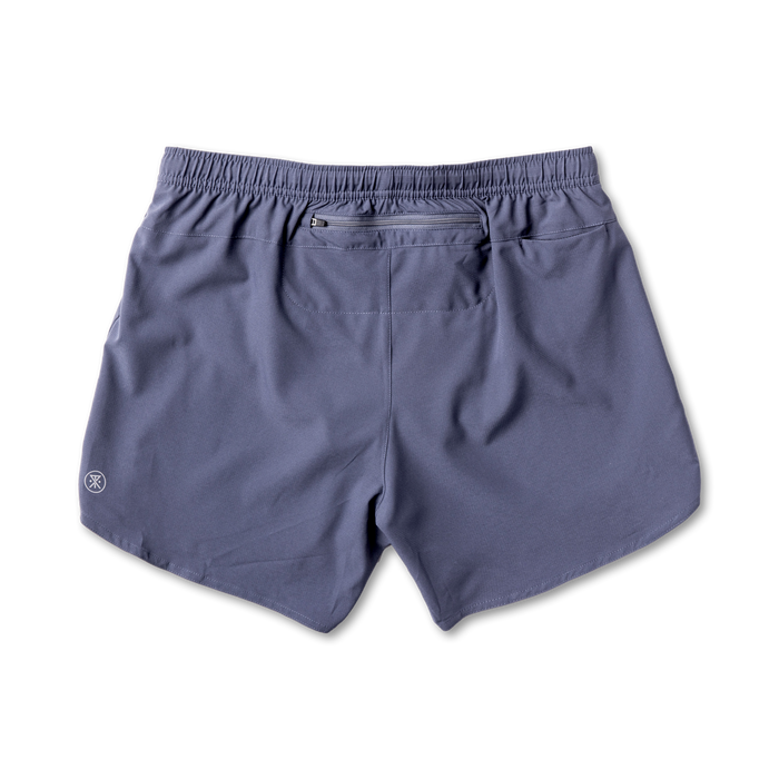 Active man wearing versatile Roark shorts ideal for adventure and outdoor activities, prominently displaying functionality and style.