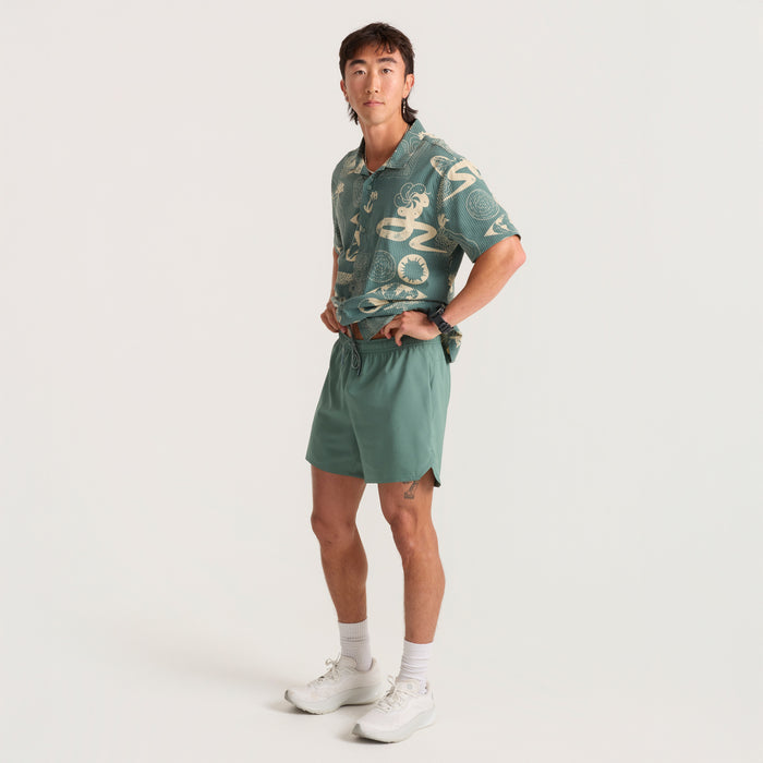 Model wearing versatile Roark running shorts, perfect for any adventure, with a focus on the lightweight design and comfortable fit.