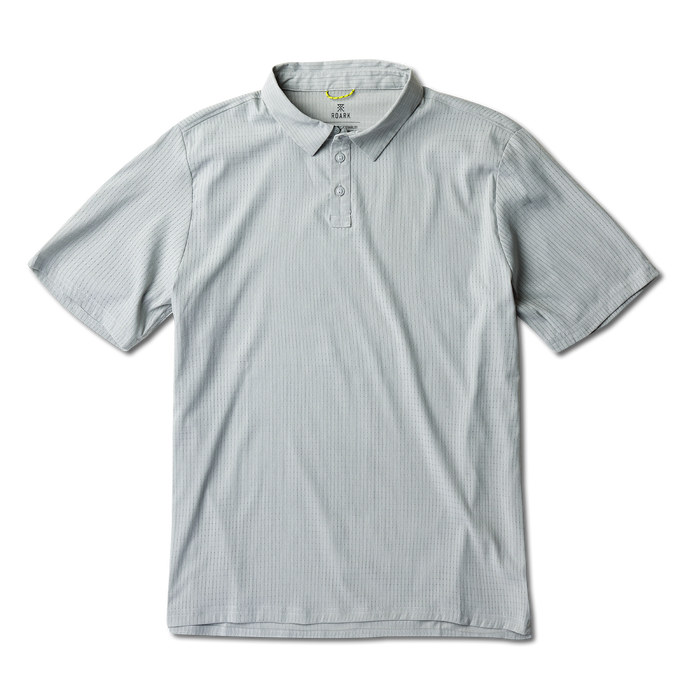 Close-up of a grey Roark active polo shirt highlighting the sleeve and collar details, designed for adventure and travel.