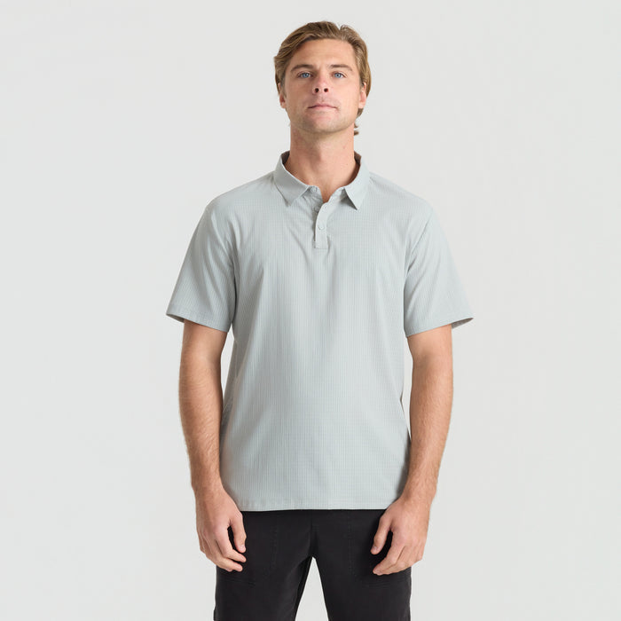 Gray active polo shirt featuring a rugged collar and sleeves, designed for adventure and outdoor activities by Roark.