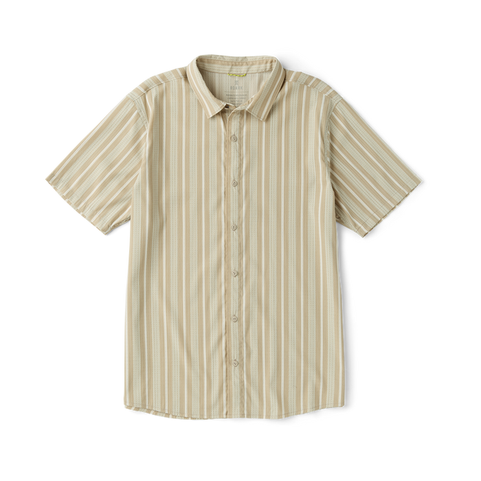 Close-up of an adventure-ready active shirt by Roark, featuring durable buttons, a firm collar, and versatile sleeves in a beige color.