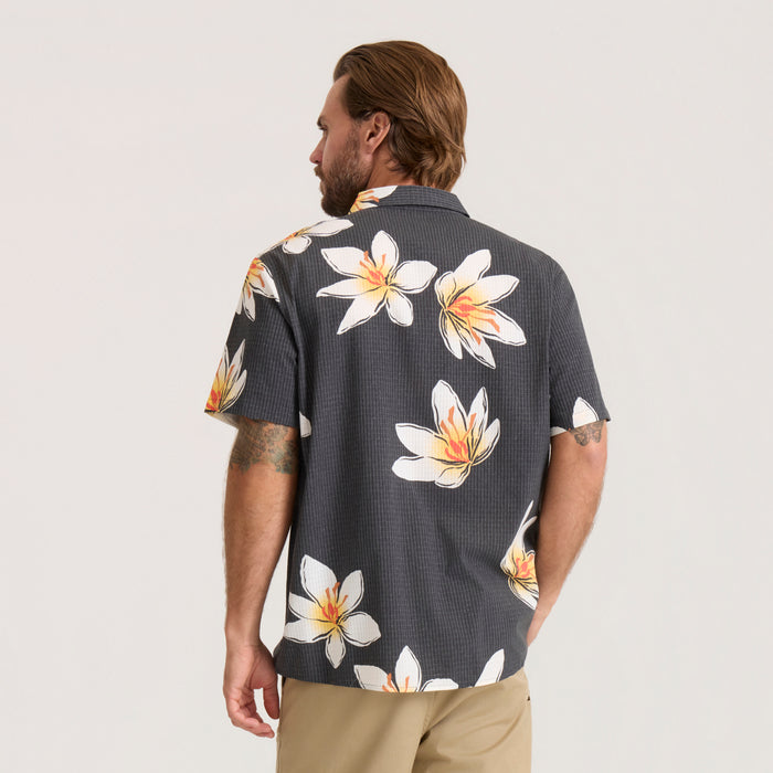 Bless Up Breathable Stretch Shirt in black with white and orange floral crocus print, shown from back on model