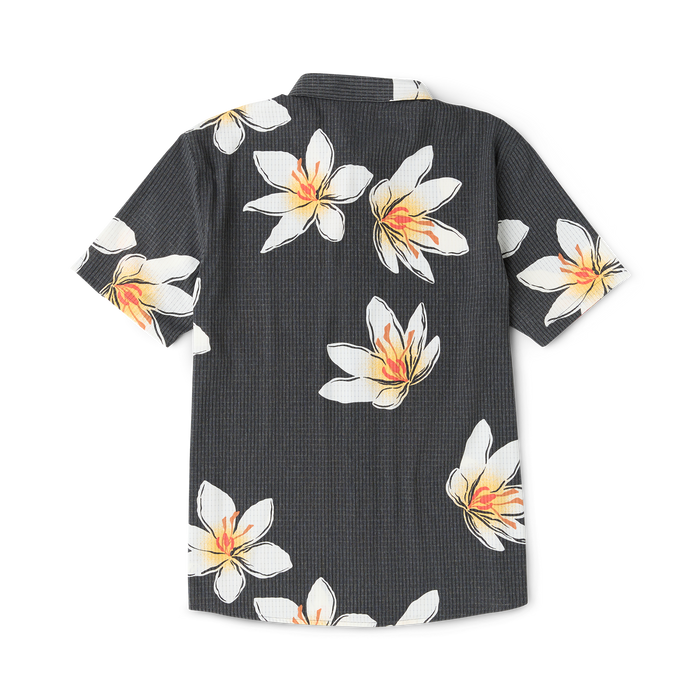 Black short-sleeve shirt with white and orange crocus flower print throughout, displayed flat lay on white background