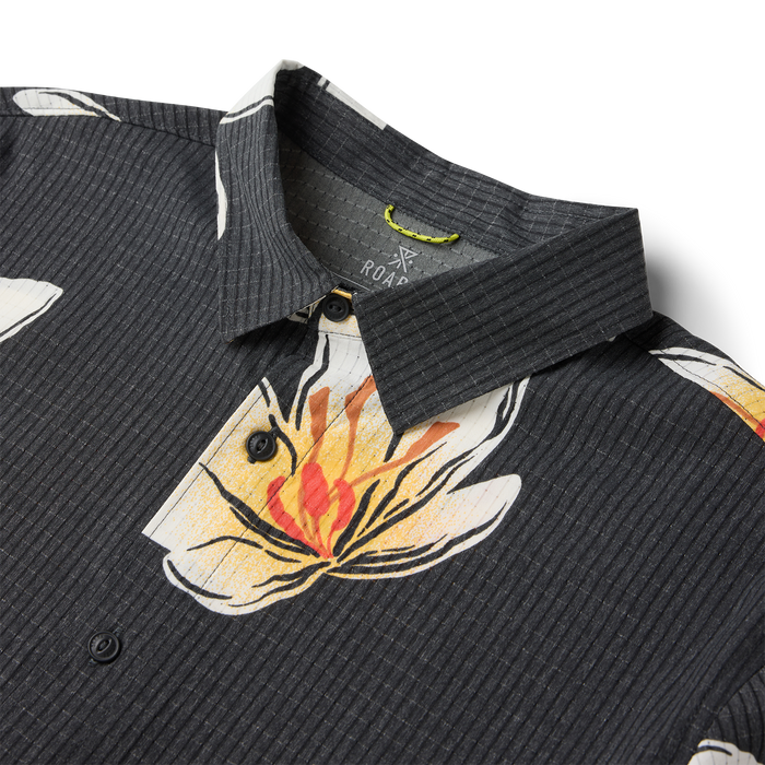 Black ribbed short sleeve shirt with colorful floral and flame graphic print, displayed flat lay with collar and buttons visible