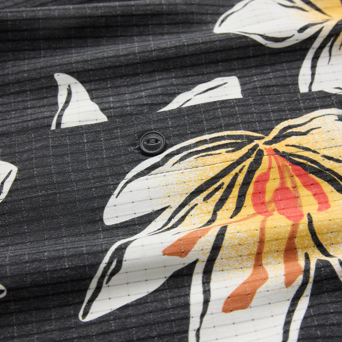 Bless Up Breathable Stretch Shirt in black with yellow, red, and white floral crocus design, detail shot showing fabric texture and button