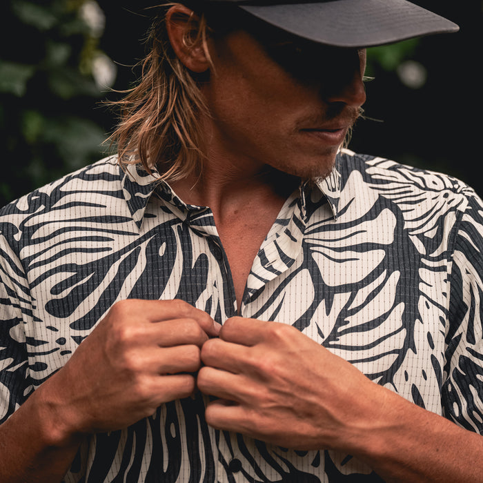 Stylish active shirt featuring a detailed collar and sleeves, perfect for adventure and travel