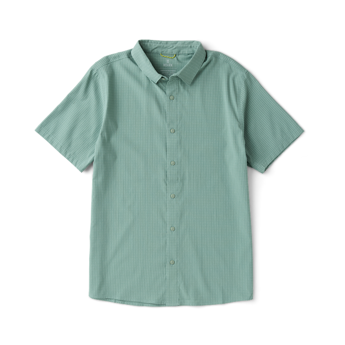 Close-up of a versatile Roark adventure dress shirt featuring detailed stitching on the collar, sleeves, and buttons, perfect for outdoor and travel activities.