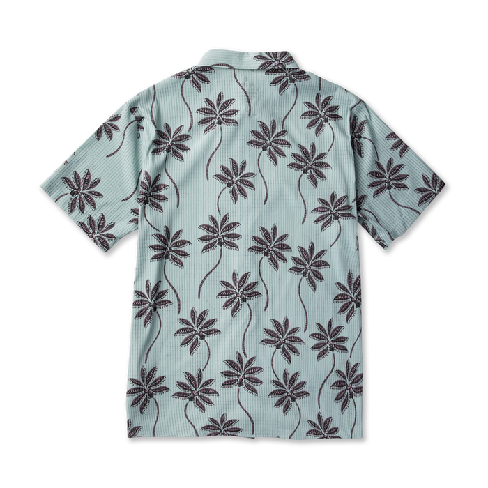 Bless Up Breathable Stretch Shirt in hazy blue with dark palm leaf print, displayed flat lay view from back