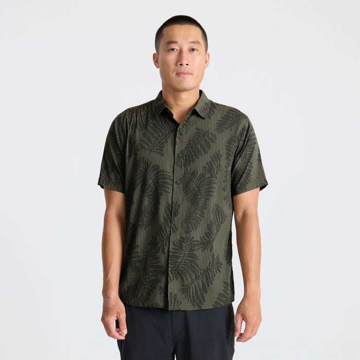 Close-up of a stylish Roark active shirt featuring a detailed collar and buttons, ideal for adventure and travel.