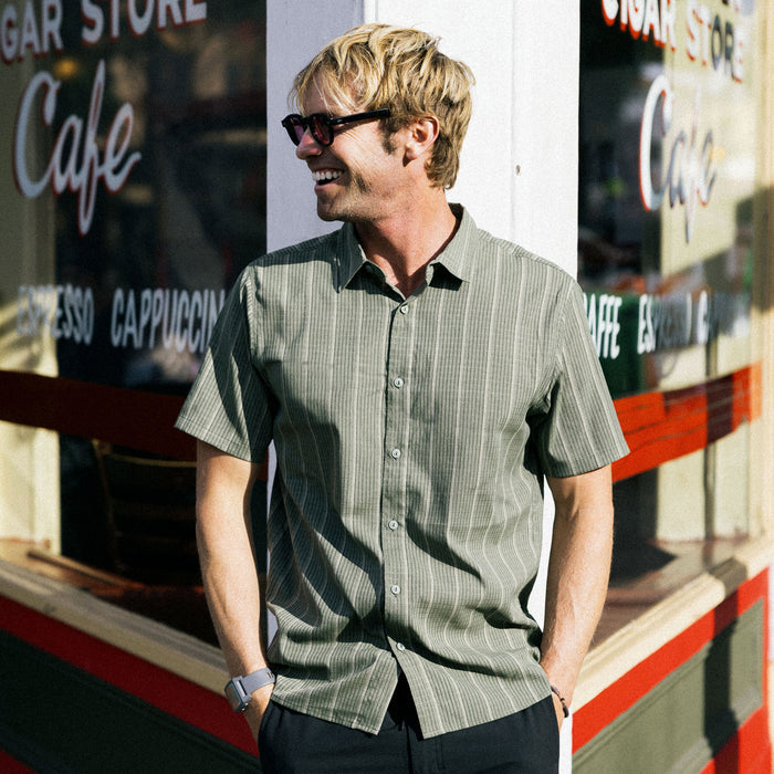Roark's Bless Up Shirt featuring a collar, button-up front, chest pocket, and long sleeves, perfect for outdoor and travel adventures.