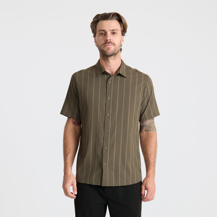 Close-up of a versatile Roark adventure shirt featuring a detailed collar, buttons, and pocket design, perfect for outdoor exploring.