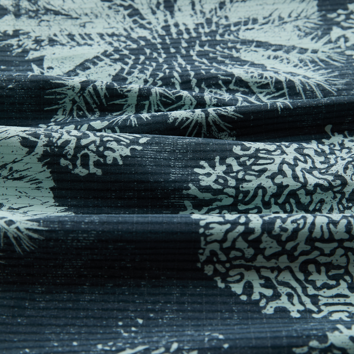 Creative grey textile with intricate motifs, designed for adventure and travel, perfect for outdoor enthusiasts.