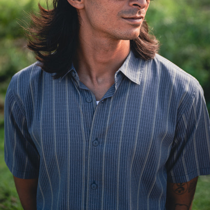 Versatile and durable Roark BlessUp active dress shirt featuring a collar, buttons, and sleeves, ideal for adventure and travel.