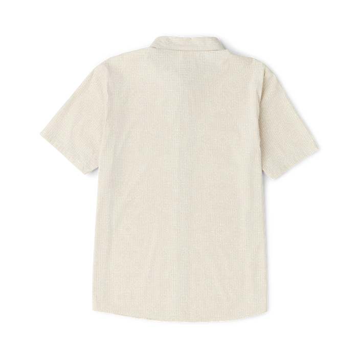 Cream textured short sleeve button-up shirt displayed on flat lay against white background, back view