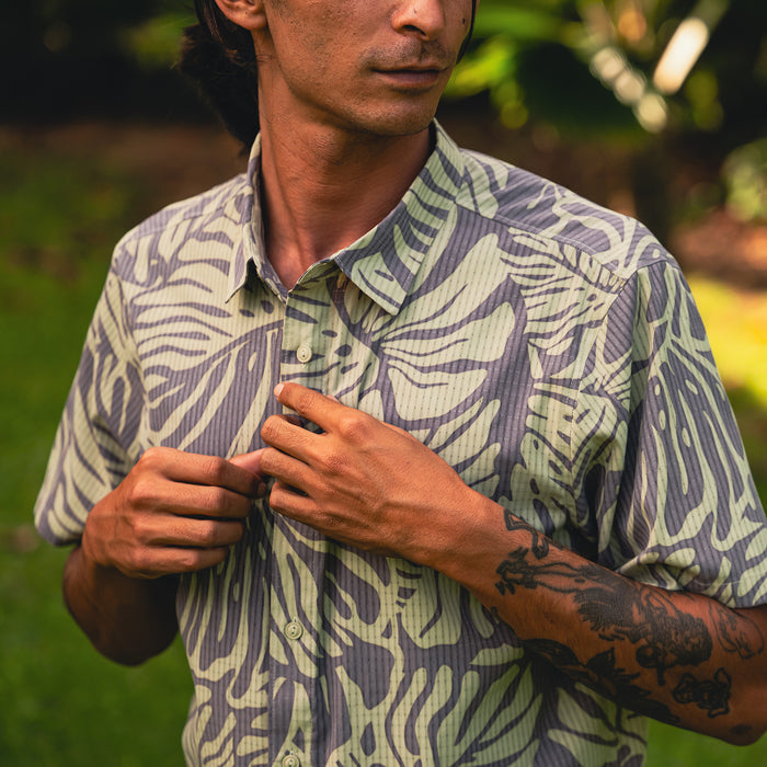 Close-up of a high-quality dress shirt featuring detailed collar and sleeve design, perfect for travel and outdoor adventures.