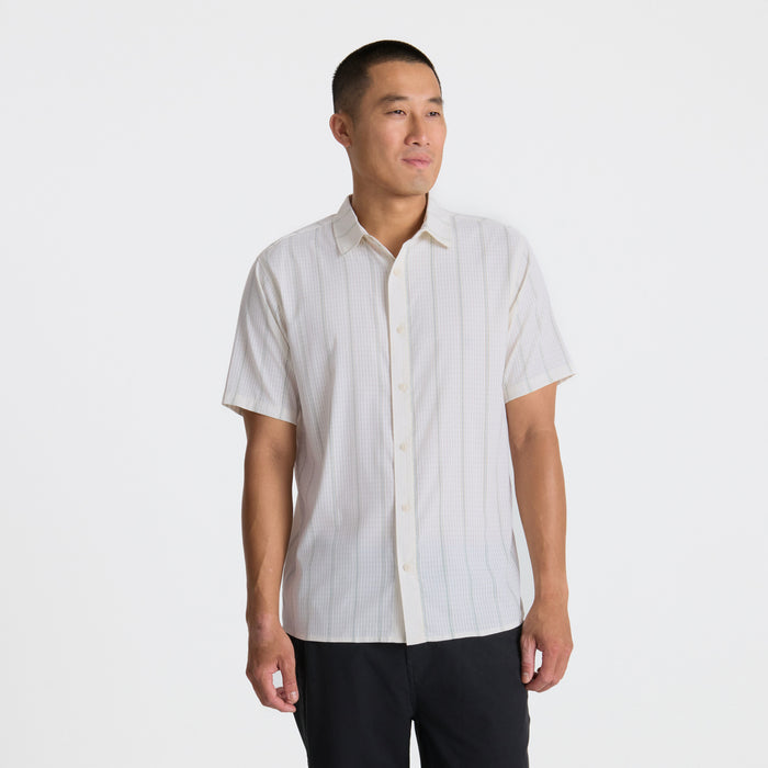 Dress shirt with visible collar, buttons, and sleeves designed for adventure and travel by Roark, crafted to blend style and functionality.