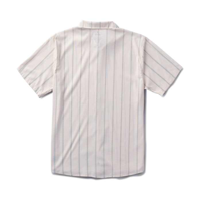 Close-up of a white Roark dress shirt featuring a detailed collar and buttons, designed for adventure and travel.