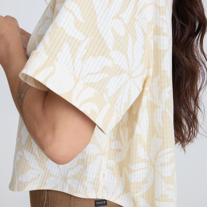 Close-up of a Roark active shirt featuring intricate patterns on the textile, detailed collar, and sleeve design, embodying adventure and travel aesthetics.
