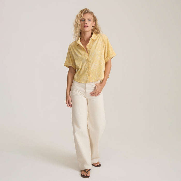 Bless Up Camp Button Up Shirt in wheat with abstract palm print, worn with cream pants on model