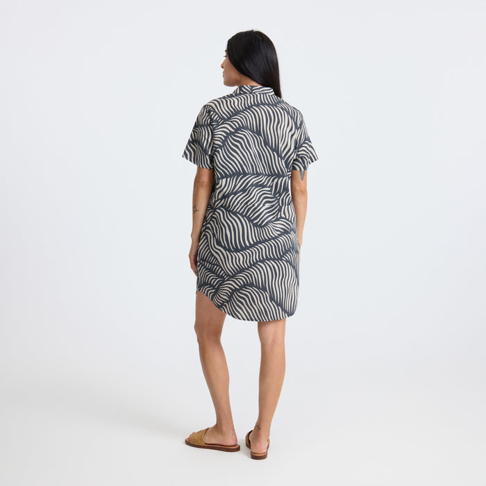 Versatile patterned day dress perfect for adventure and travel, displayed in a one-piece garment style.