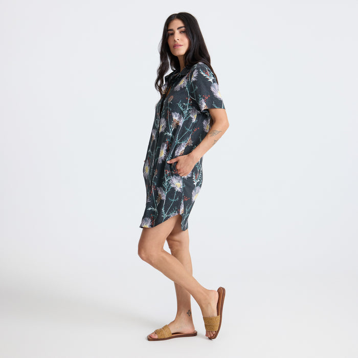 Close-up of a stylish adventure-ready dress by Roark featuring detailed sleeve, collar, and textile design, perfect for outdoor travel.