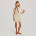 Model wearing a stylish day dress outdoors, embodying Roark's adventure-ready fashion aesthetic