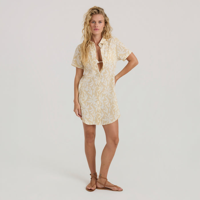 Model wearing a stylish day dress outdoors, embodying Roark's adventure-ready fashion aesthetic