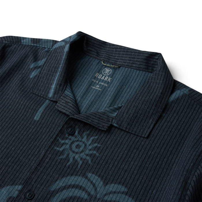 Roark Bless Up Trail button up shirt in ebony with vertical pinstripe pattern and open collar detail, flat lay view