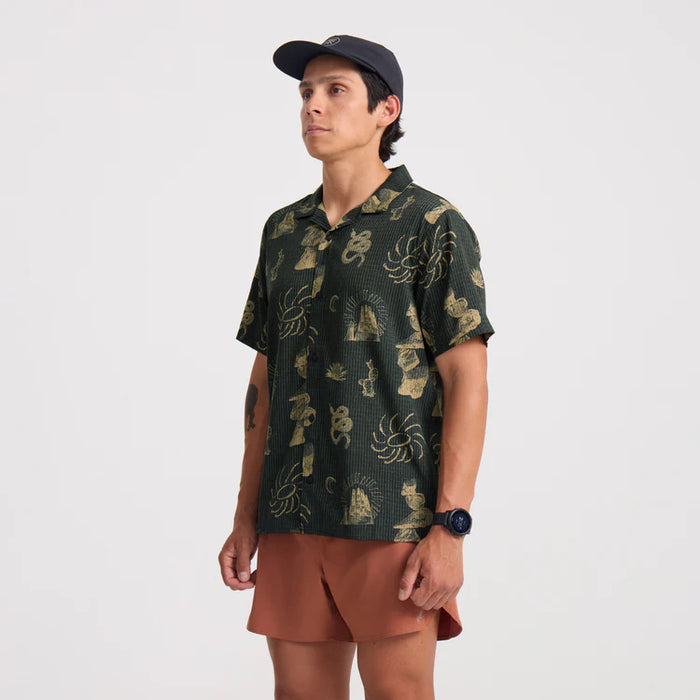 Camouflage patterned active shirt with button details, suitable for outdoor adventures and travel.