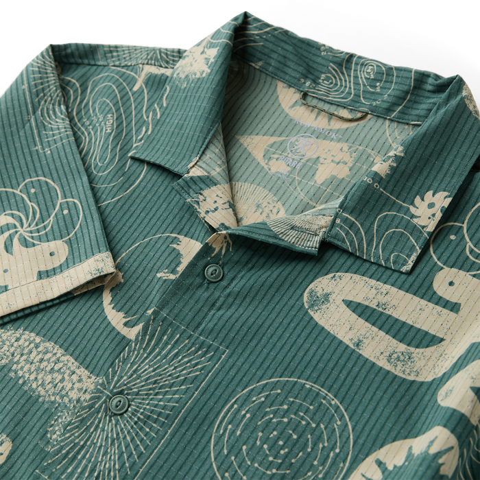 Active shirt with visible collar and sleeve details, featuring button accents, perfect for outdoor adventures and travel.