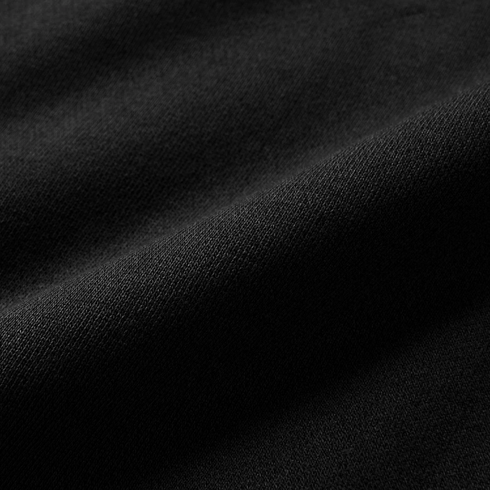 Close-up texture of durable woven fabric, ideal for Roark's adventure and travel gear.
